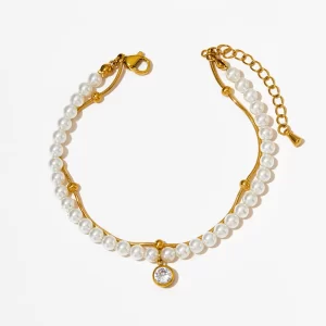 18K gold-plated pearl bracelet with a crystal pendant, displayed on a clean white background for a polished and elegant presentation.
