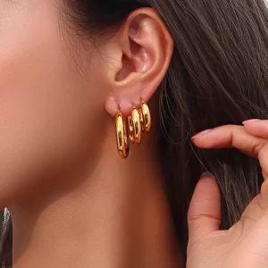 Layered gold hoop earrings with multiple hoops, stylish and durable.