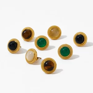 A set of eight gold earrings with black onyx, green agate, tiger's eye, and other gemstone cabochons.