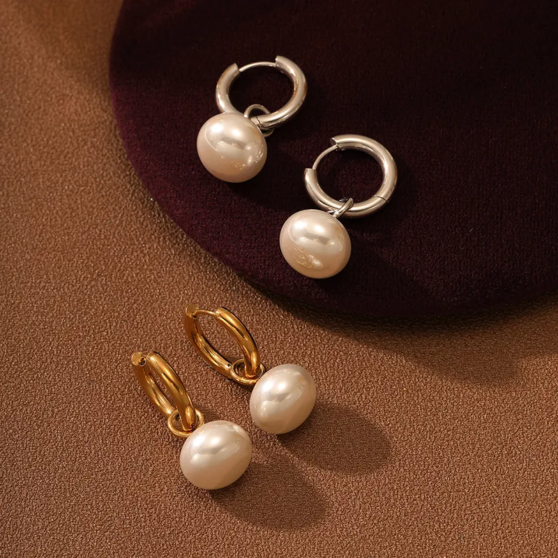 Pearl hoop earrings in gold and silver finishes, designed to be waterproof and fade-resistant for long-lasting wear.