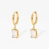 Gold hoop earrings with rectangular clear stone pendant, lightweight and stylish design.