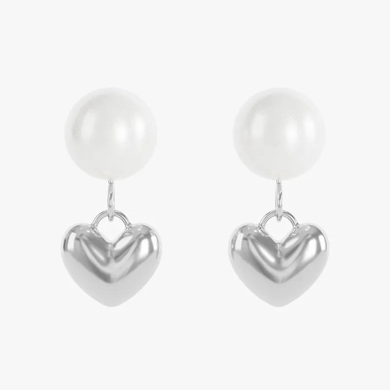 Stainless steel earrings with pearl and heart-shaped pendant, offering a timeless and elegant design.