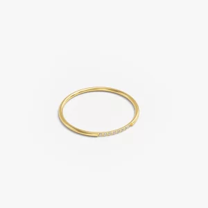Gold ring with 8 diamonds accents, showcasing a sleek and elegant design.