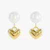 A pair of 18K gold-plated pearl earrings with heart-shaped gold charms, designed to be waterproof and tarnish-resistant.