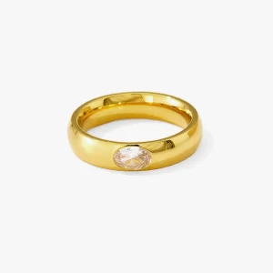 Gold ring with an oval clear cubic zirconia stone.