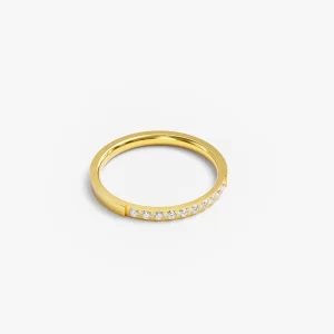 Gold ring with diamonds displayed on a white background, highlighting its polished finish and elegant design.