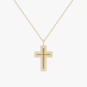 Gold cross pendant necklace set with cubic zirconia crystals, hanging from a fine chain against a white background.