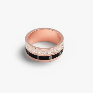Rotating Roman numeral ring with cubic zirconia accents in rose gold.