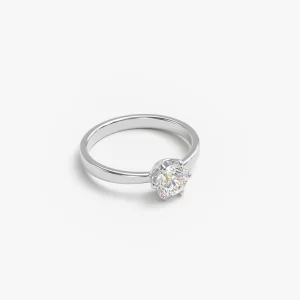 Stainless steel solitaire ring with a diamond displayed on a white surface, highlighting its elegant design.