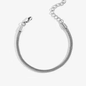 Close-up of a stainless steel snake chain bracelet with an adjustable extension chain and lobster clasp, designed to be waterproof and tarnish-resistant.