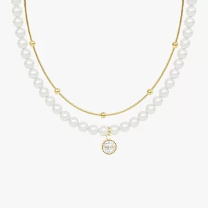 18K gold-plated pearl and crystal pendant necklace with a two-layer design, featuring a sparkling cubic zirconia pendant, displayed against a neutral background.