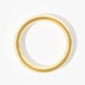 Gold bangle bracelet with smooth, shiny finish, waterproof and tarnish-resistant.