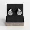 Stainless steel silver teardrop stud earrings with polished finish, presented in a gift box.
